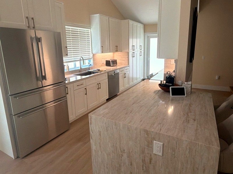 Completed luxury kitchen remodel with stone island and custom cabinetry, Palm Beach County
